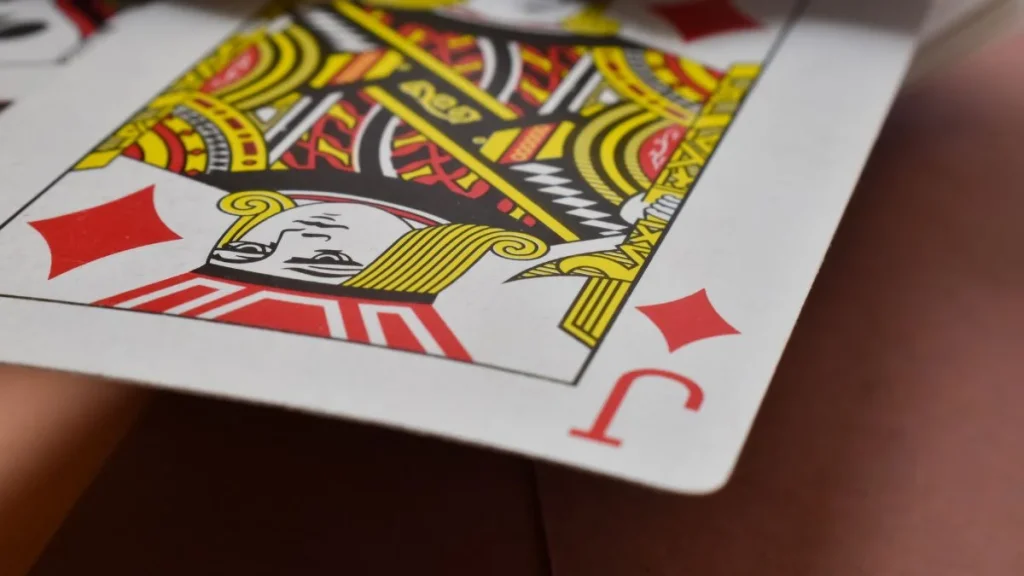 How To Play Knock Rummy: Rules, Setup, And Scoring Knock Rummy card game in action with players and cards laid out